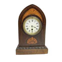 Edwardian - 8-day Rosewood veneered Lancet shaped mantle clock with contrasting inlay and satinwood stringing,  white enamel dial with Roman numerals, minute markers and spade hands, French timepiece movement with pendulum. c1910.