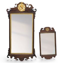 Late 19th century Chippendale style mahogany wall mirror, featuring gilded eagle pediment; together with a smaller similar mirror