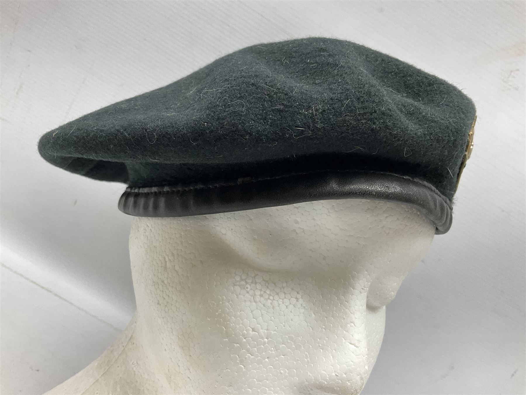 WW1 British Army Derby Scheme 1915 Attested armband; beret with East Yorkshire cap badge; pair of fur lined leather flying/motorcycle goggles; HMS Pembroke cap band; and small quantity of RNAS cloth and metal badges etc