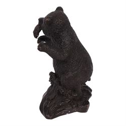 Bronze bear, upon a naturalistic base, with a fish in mouth, H17cm