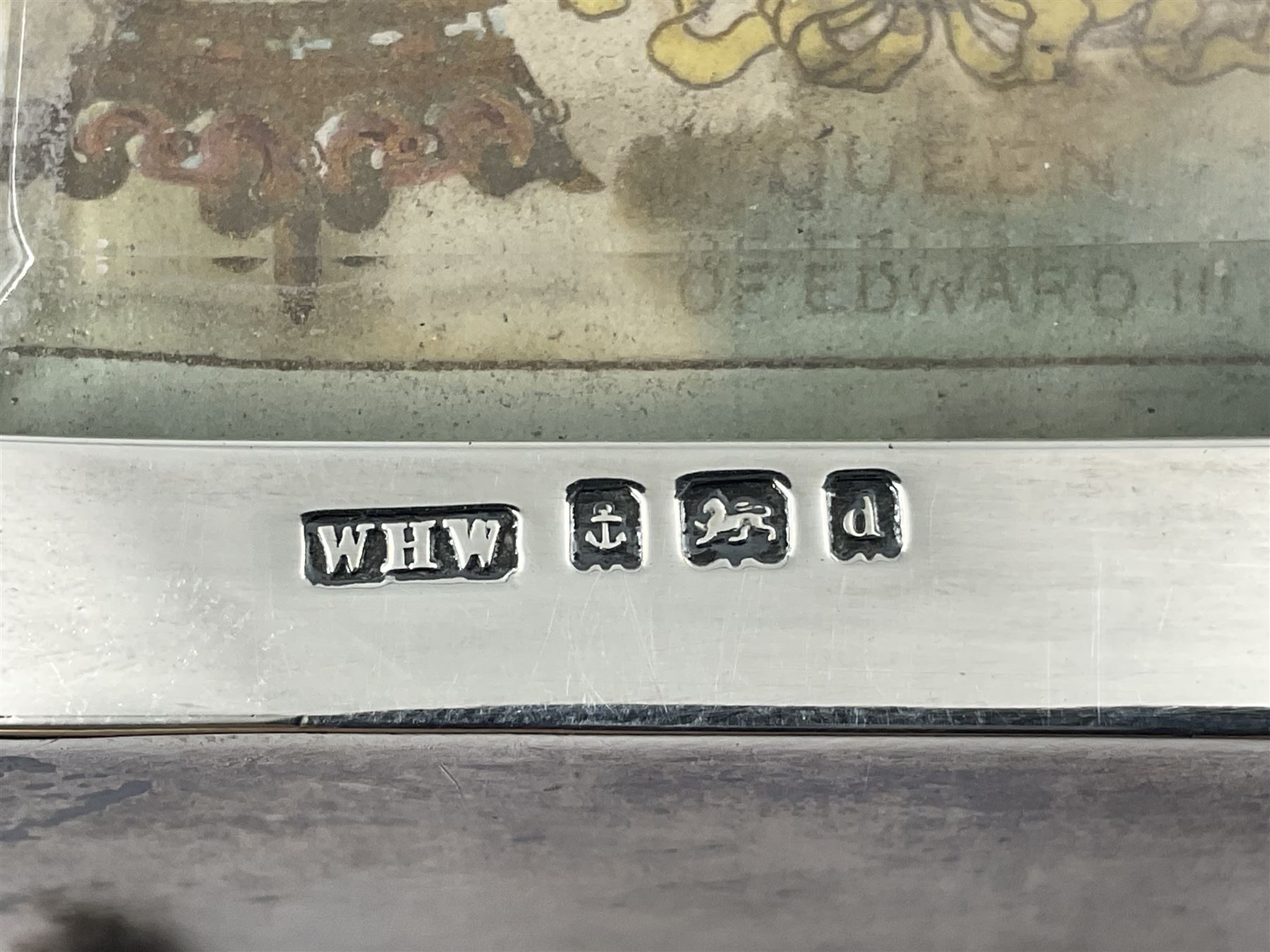 Edwardian silver mounted playing card case, hallmarked William Harrison Walter, Birmingham 1903, the sides each with a period playing card set behind a bevelled glass panel, the hinged cover with later engraving 'Presented to Norman T Crombie Esq by the officers & men of the 31st WR Detachment for services rendered 1917-1918', with red leather lined interior, the three compartments upon a sprung base and containing two later wooden Whist markers, case H12.5cm