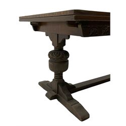 20th century oak drawer leaf extending dining table, two foliage carved baluster supports on sledge feet joined by floor stretcher 