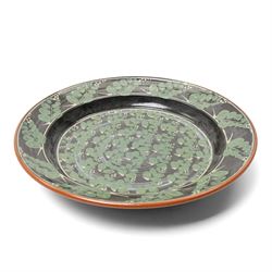 Richard Phethean (1953-): Slipware charger, decorated with green foliage on a black ground, D40cm 