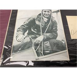 Amy Johnson (1903-1941) English Pioneer Aviatrix - pencil signature on album page double mounted with a photographic print of Amy in flying dress seated in a cockpit; unframed