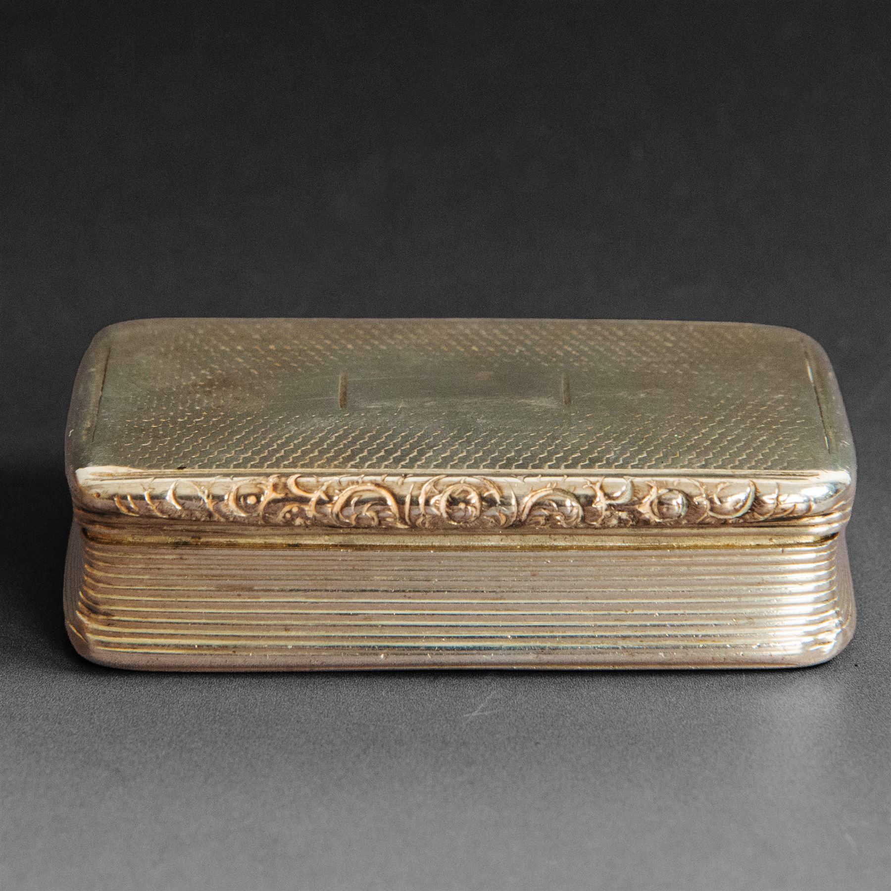 William IV silver snuff box, of rectangular form with rounded corners and embossed lip, the hinged cover with engine turned decoration and vacant cartouche, hallmarked Joseph Willmore, Birmingham 1830, H2cm, W7cm