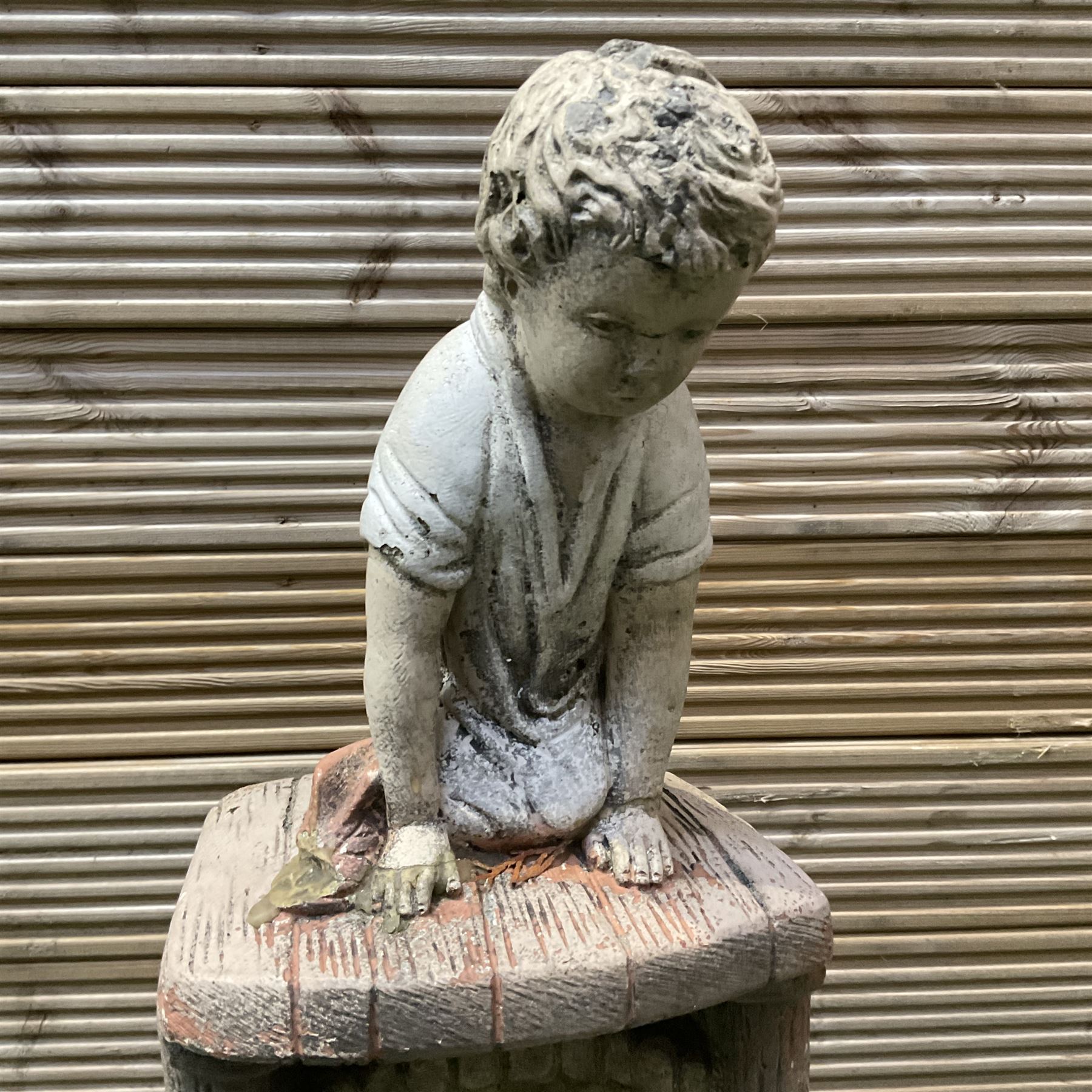 Cast stone ornament of a kneeling boy with a water feature  - THIS LOT IS TO BE COLLECTED BY APPOINTMENT FROM DUGGLEBY STORAGE, GREAT HILL, EASTFIELD, SCARBOROUGH, YO11 3TX