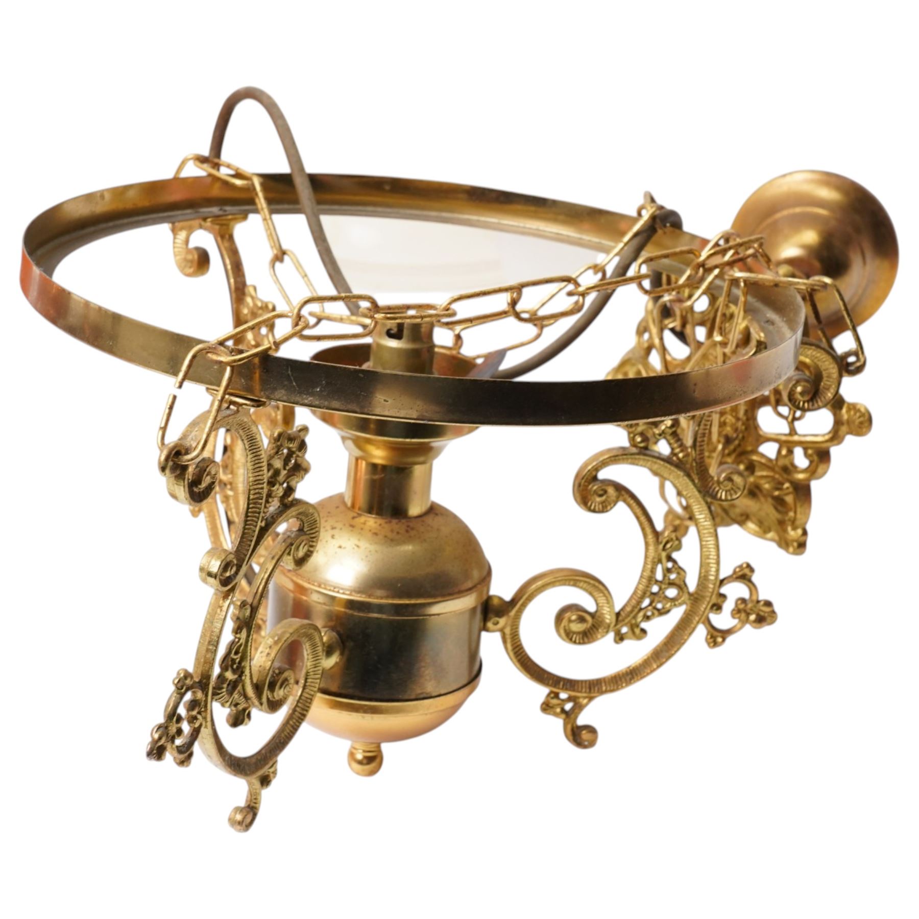 Pair of brass pendant light fittings with orange glass shades and another with partly frosted glass shade 