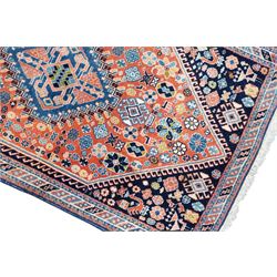 Small Afghan rust ground rug, plain field enclosed by patterned borders (94cm x 64cm); small Persian Hamadan indigo ground rug, decorated all-over with small flower head and bird motifs (118cm x 66cm); and a small Persian red ground rug (94cm x 62cm) (3)