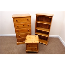  Solid pine chest, five drawers, plinth base (W66cm, H119cm, D44cm) a pine bedside chest, two drawers, turned supports (W46cm, H53cm, D40cm) and an open bookcase, three adjustable shelves, bun feet (W62cm, H122cm, D33cm)  