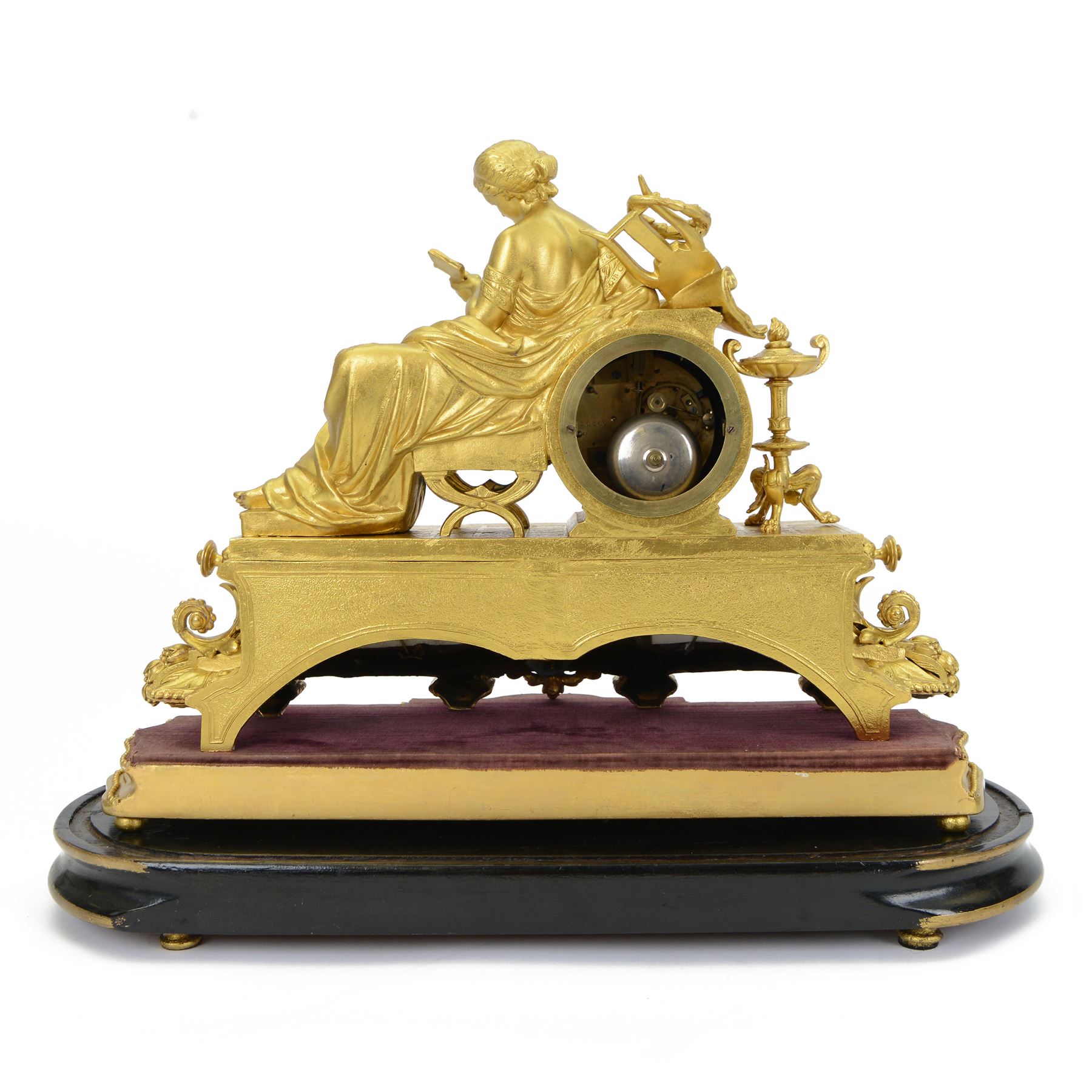 French- Napoleon III porcelain inset 8-day figural clock in a gilt case c1870, drum housed movement resting on a rectangular plinth with light blue porcelain panels each painted with different classical images and depictions from antiquity, conforming dial with a garland of flowers to the centre, gilt Roman numerals, minute track and brass spade hands, with a seated figure of a classical maiden reading a book, mounted on a matching gesso base with a velvet padded top, Parisian countwheel striking twin train movement, striking the hours and half hours on a bell. With a contemporary ebonised base and oval glass dome. With pendulum.
