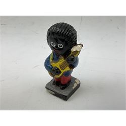 Robinson Jam plaster Golly band, including drummer and singer, H7.5cm

Originally handmade by mothers in Africa for their children from old fabric and cloth, the golly doll was adopted as the mascot and trademark for the Robertson's confectionery brand around 1910 after the company's founder John Robertson visited the US and noticed children playing with them. Robertson's Gollies have been collected by people across the UK and around the world for generations but garnered a contentious image in the 1980s because of links to racism. The trademark was removed from Robertson's branding in 2001.