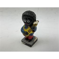 Robinson Jam plaster Golly band, including drummer and singer, H7.5cm

Originally handmade by mothers in Africa for their children from old fabric and cloth, the golly doll was adopted as the mascot and trademark for the Robertson's confectionery brand around 1910 after the company's founder John Robertson visited the US and noticed children playing with them. Robertson's Gollies have been collected by people across the UK and around the world for generations but garnered a contentious image in the 1980s because of links to racism. The trademark was removed from Robertson's branding in 2001.