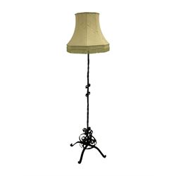 Wrought metal standard lamp with shade
