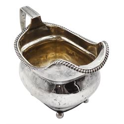George III silver cream jug, plain baluster design raised on ball feet London marks rubbed approx 3.5oz