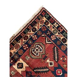 Near pair of Persian Azerbaijan red ground runners, each rug decorated with Nazarlik and stylised leaf motifs, enclosed with three band border decorated with flower heads and geometric motifs 

406cm x 99cm 
409cm x 102cm
