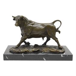 Bronze figure, modelled as a prancing bull, upon a naturalistic base signed Mils and with ...
