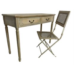 Two-drawer side table, moulded rectangular top over two drawers, on turned and fluted supports; together with a folding side chair with cane seat and back 