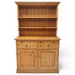Traditional pine kitchen dresser, the open rack with three shelves beneath a moulded top, ...