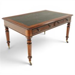 Mid Victorian four drawer mahogany partners' writing table, with leather inset top with moulded edge, with two frieze drawers to either side, on turned supports terminating in castors