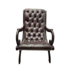 Regency style armchair, upholstered in buttoned leather with studded detail