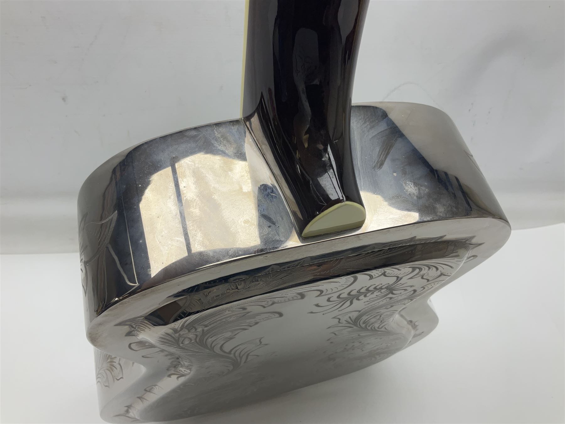 Ozark metal cased resonator guitar with all over chased foliate decoration to the polished finish and mother-of-pearl inlay to the fretboard L100cm; in Stagg hard carrying case