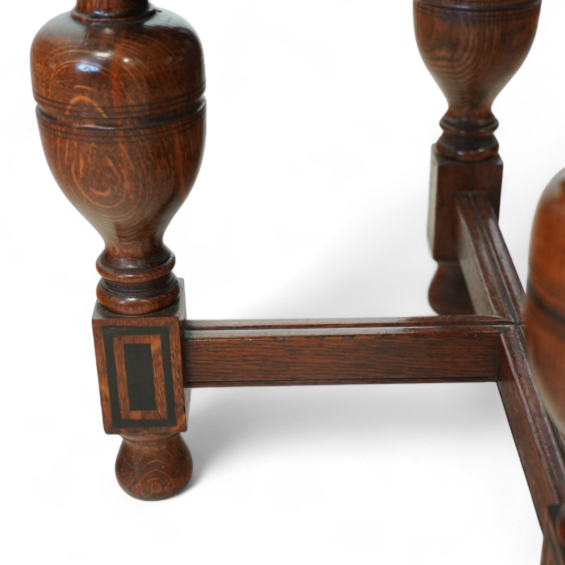 Late Victorian oak centre table, octagonal moulded top over a carved Gothic arched frieze, raised on quadruple baluster turned supports united by X-stretcher with ebonised detailing