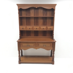 20th century mahogany dresser, raised two tier plate rack with five trinket and two drawers, turned supports joined by solid undertier, W127cm, H198cm