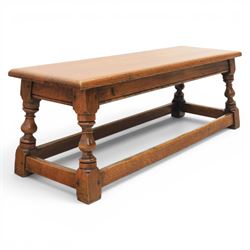 17th century style oak long joint stool, rectangular top with moulded edges, raised on turned supports united by stretchers