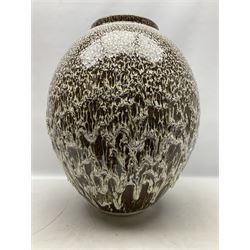 Large studio pottery vase of ovid form, decorated with a white drip glaze on a brown ground, with impressed artist mark 'A M', H55cm