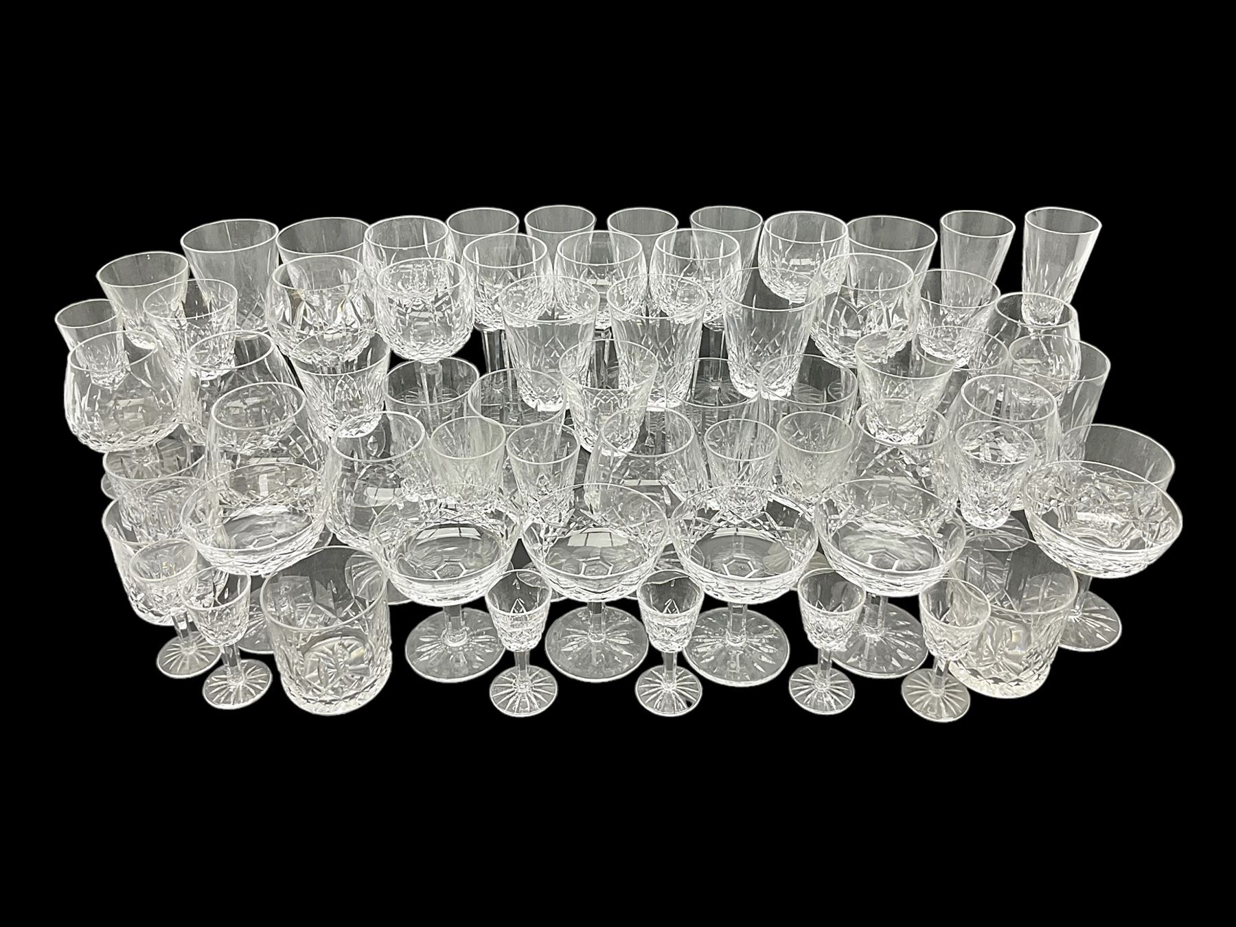 Set of Waterford Crystal Lismore pattern drinking glasses for six people, including hock glasses, goblets, champagne flutes,  sherry glasses, liqueur glasses, hi ball glasses, whisky glasses, brandy balloons, etc, all with etched maker's mark beneath  (62)