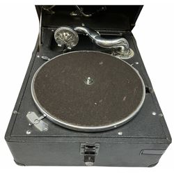 HMV portable wind up gramophone in a black case, together with a collection of records. 