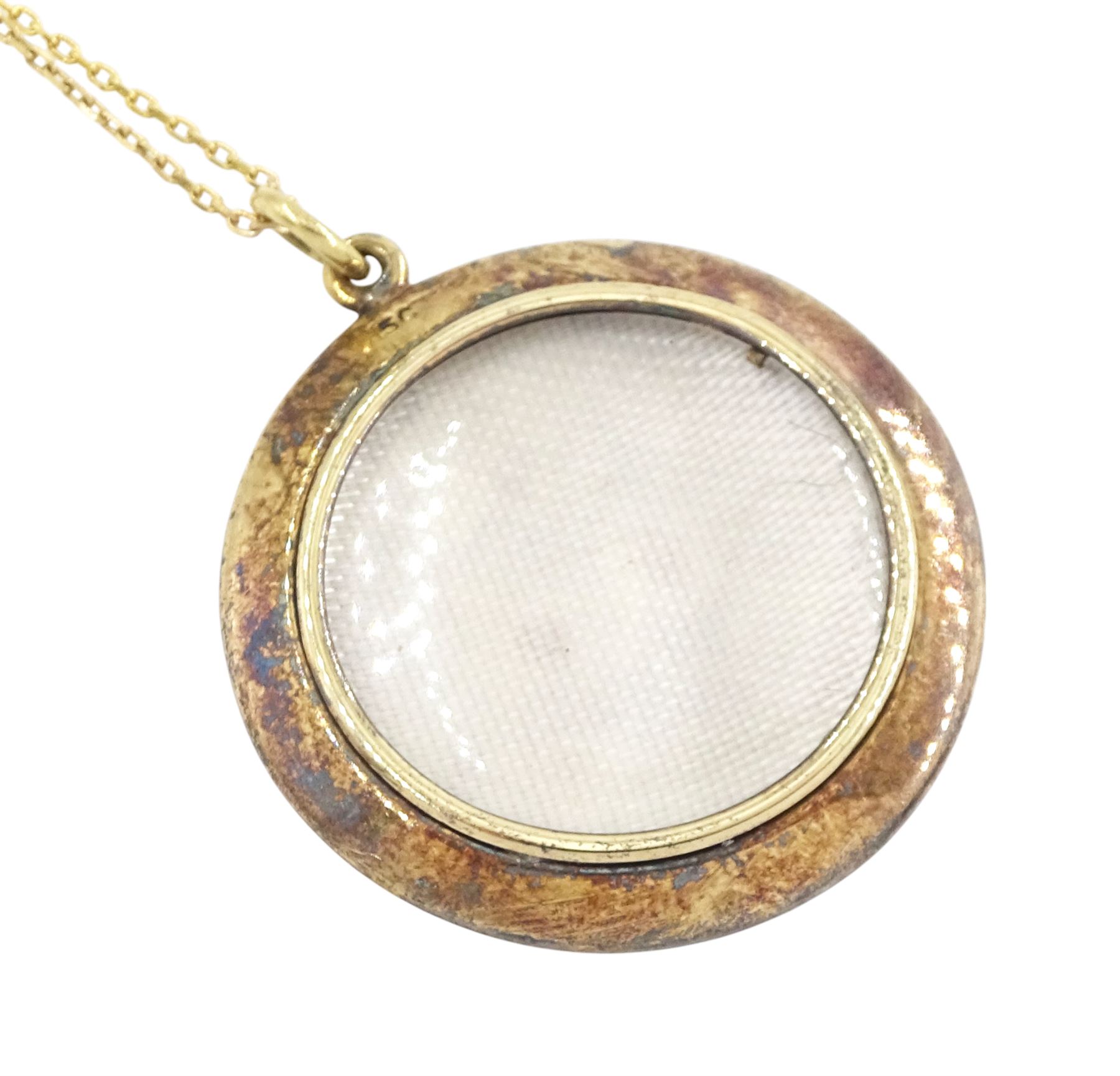 Early 20th century gold blue enamel pendant, with applied seed pearl Navel crown decoration, with glazed back, stamped 9ct, on later 9ct gold chain necklace, stamped 375