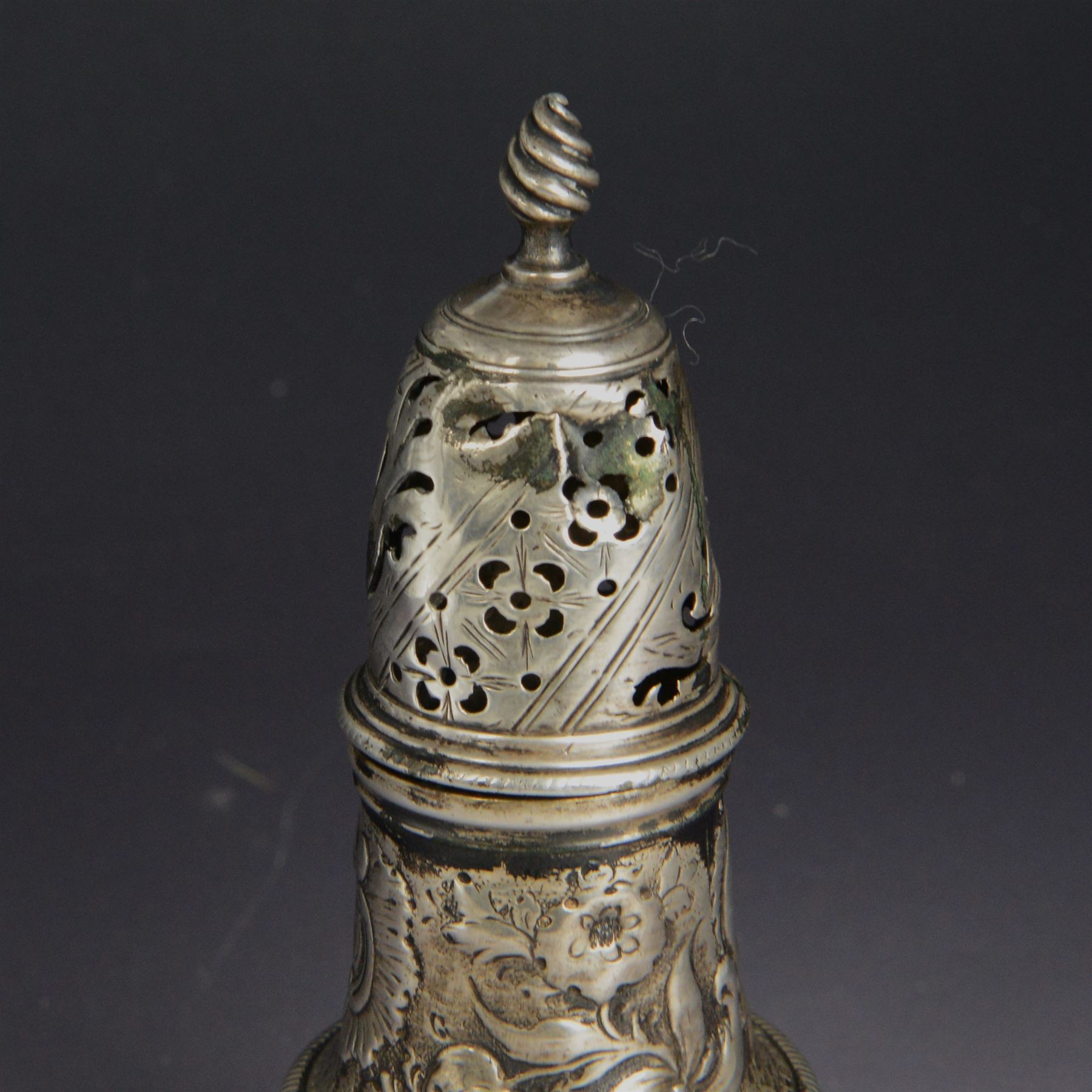 George III silver sugar caster, of typical form profusely embossed with floral and foliate details, hallmarked Jabez Daniell & James Mince, London 1768, H15cm