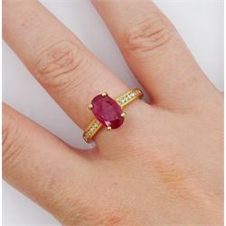 18ct gold oval ruby ring, with round brilliant cut diamond shoulders, hallmarked, ruby approx 2.35 carat