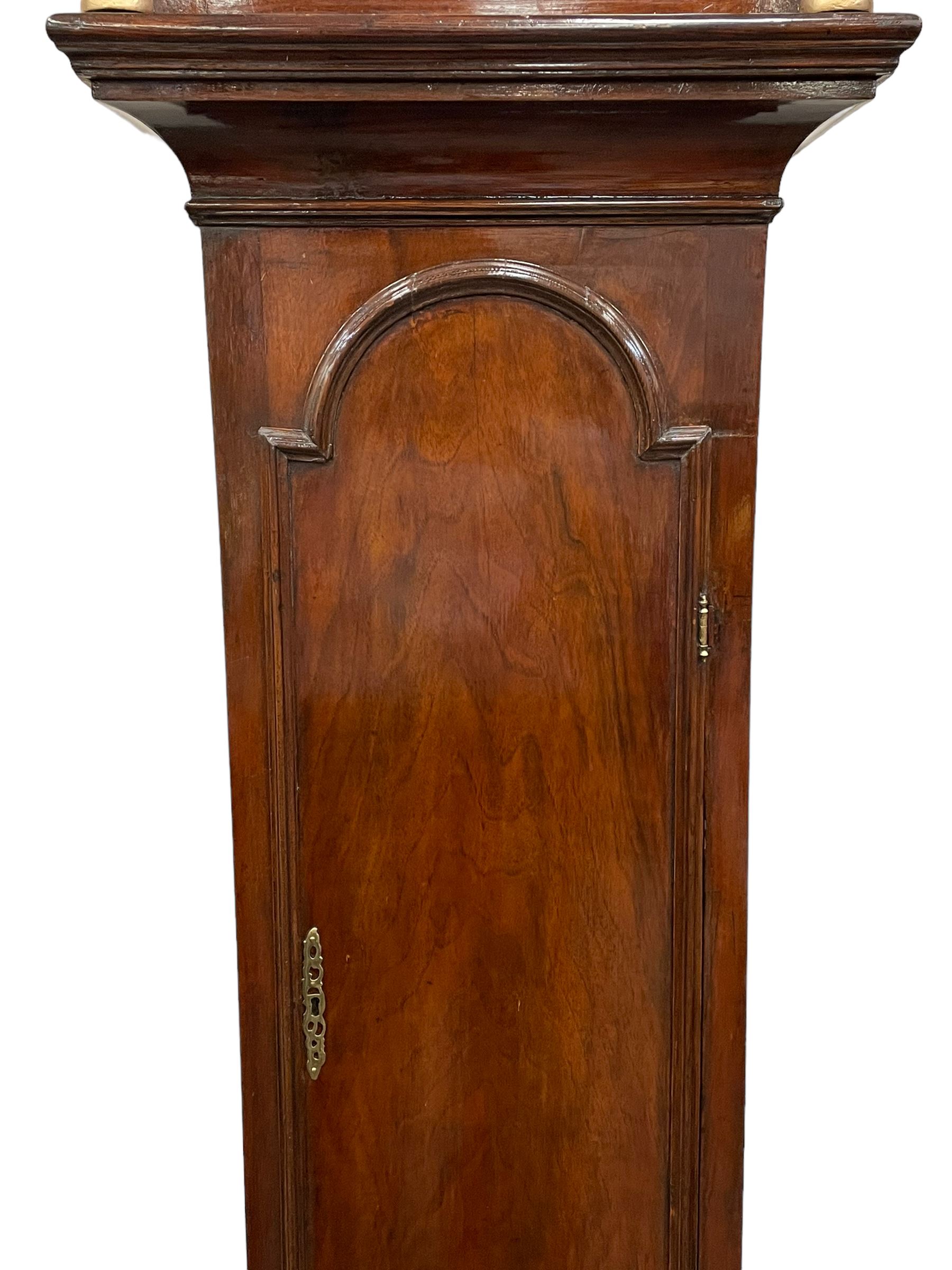 John Abbot of London – early 18th century walnut 8-day longcase clock c1740, hood with glazed side panels and tall swept pagoda pediment above a break arch hood door with attached pillars and gesso wooden capitals, long trunk door with a conforming break arch top on a rectangular plinth with applied shaped skirting, brass dial with a matted center and continuous herringbone engraving to the surround, cast spandrels, silvered chapter with Roman numerals, five minute Arabic’s, minute track and inner quarter hour track, subsidiary seconds dial and square date aperture, silvered tempus fugit boss to the break arch, dial pinned directly to a rack striking movement, striking the hours on a bell. With weights and pendulum.