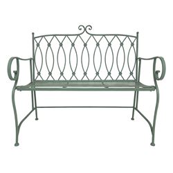 Regency design wrought metal bench, scrolled cresting rail over roundel decorated back and scrolled arms, with strap seat, in pistachio finish