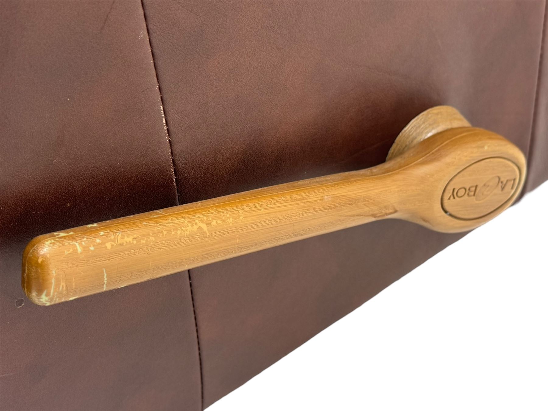 La-Z-Boy - manual reclining three piece suite - two seater sofa (W165cm, H105cm); and two armchairs (W98cm), upholstered in brown leatherette