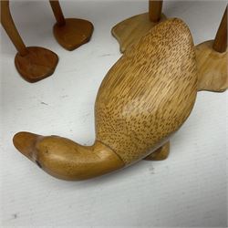 Four carved fruit wood ducks by Dcuk of various sizes, tallest H47cm