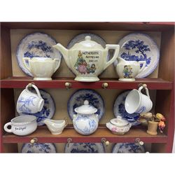 Miniature pitch pine Welsh dresser with open plate rack over two cupboard doors, displayed with Ridgways Humphrey's Clock pattern and other doll's blue/white tea ware, copper kettles and pan etc W41cm H72cm