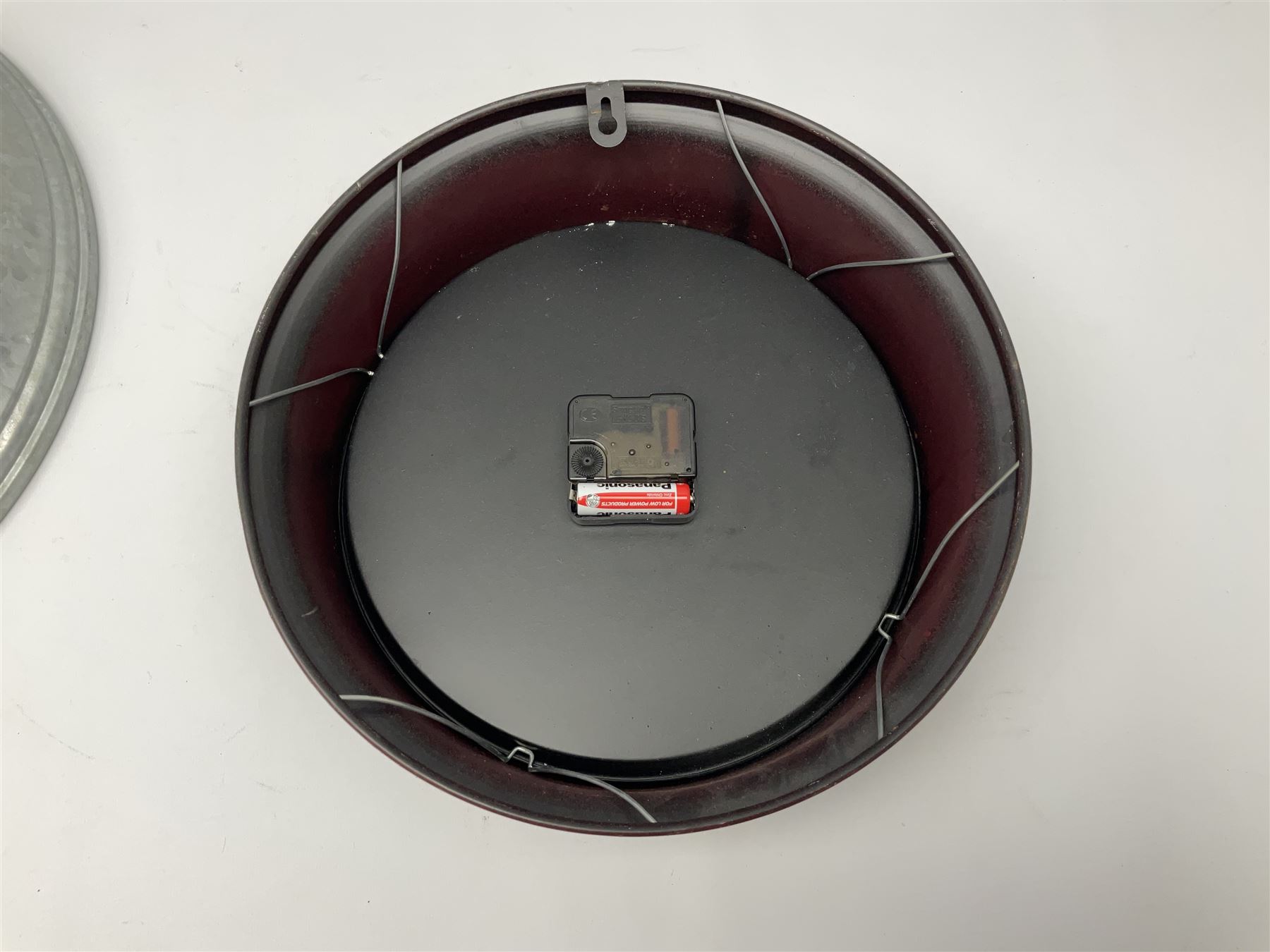 Esso Advertising Wall Clock, 'Put A Tiger In Your Tank', together with Jones & Co wall clock, largest example D40cm