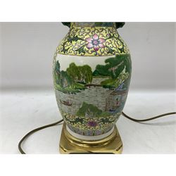 Oriental table lamp of baluster form decorated with river scene panels, on metal base, H36cm excl fitting