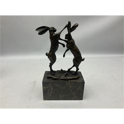 Bronze figure group, modelled as two male hares boxing, upon a naturalistic base signed Nick and with foundry mark, raised upon a rectangular marble base, H24cm
