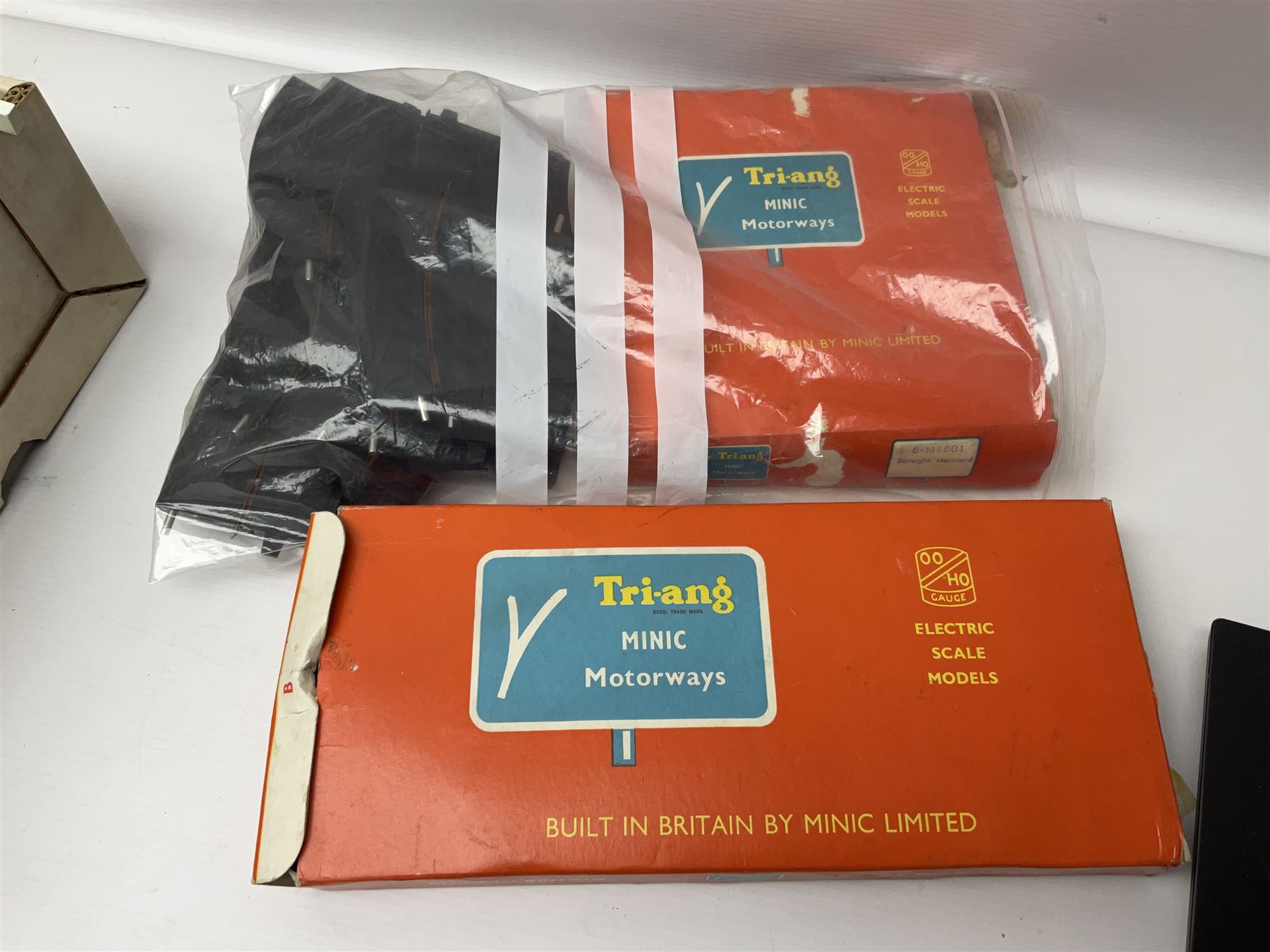 Tri-ang - quantity of '00' gauge model railway and Minic Motorways slot-racing items including Class B12 4-6-0 locomotive No.61572; boxed; seven goods wagons in five boxes; R576 Tunnel and Island Platform Set; both boxed; quantity of track and power unit; four Minic Cars and two controllers; boxed Customs Barrier and Frontier Post Set; railway car transporter and car loading ramp; quantity of track and trackside accessories; and boxed Car-Play Filling Station Set