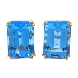 Pair of 9ct gold emerald cut blue topaz stud earrings, stamped, total topaz weight approx 16.05 carat