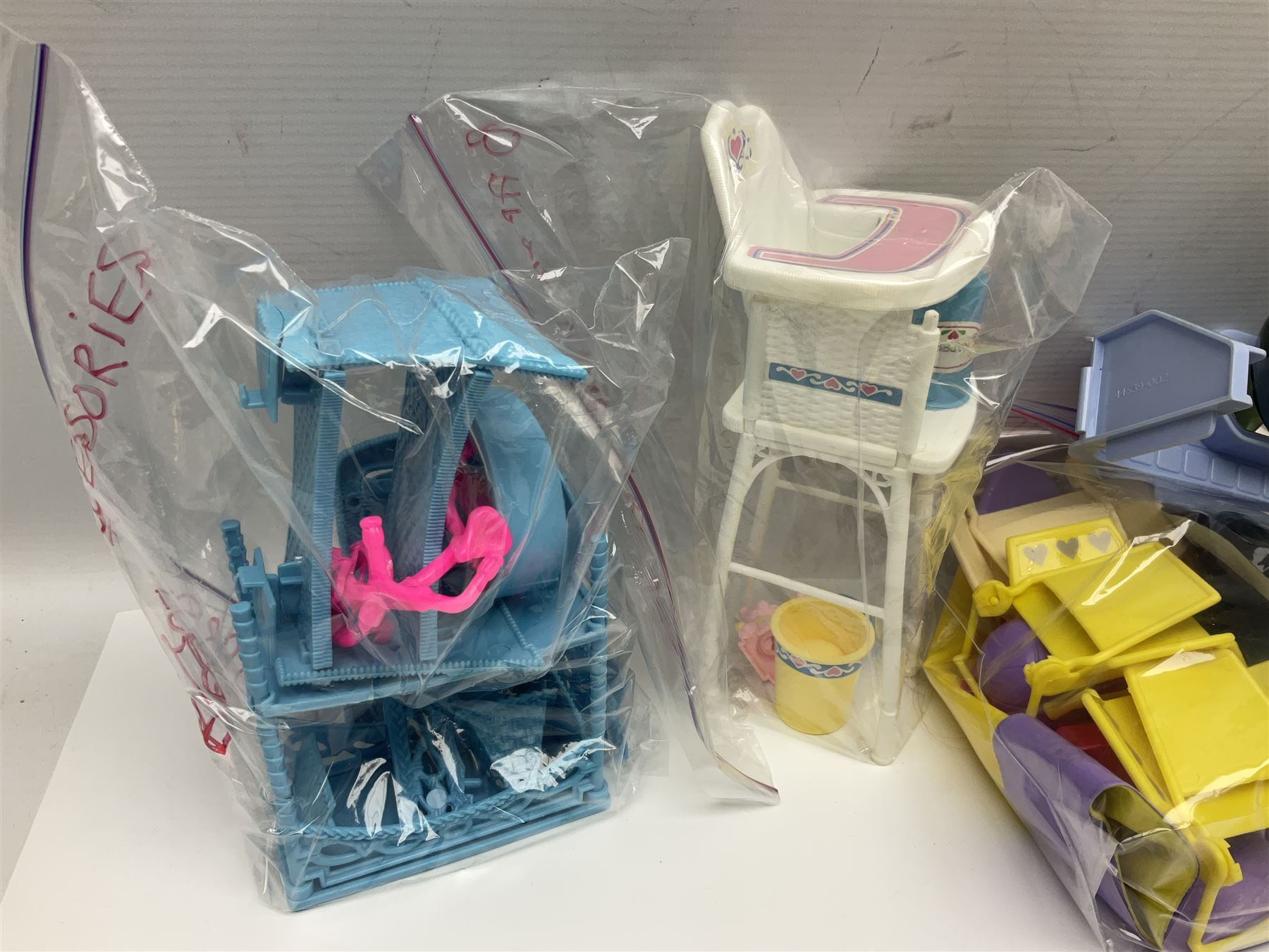 Barbie - collection of 1980s accessories including furniture and outside effects, Fluff the kitten, baby's high chair, playset and nursery items, groceries, crockery, pots and pans, homewares, television, 1985 Annual, transistor radio etc; all unboxed