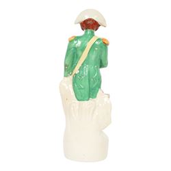 Rare mid 19th century Staffordshire pottery figure of Admiral Lord Nelson, modelled standing in uniform with green tunic, beside anchor, H27cm
