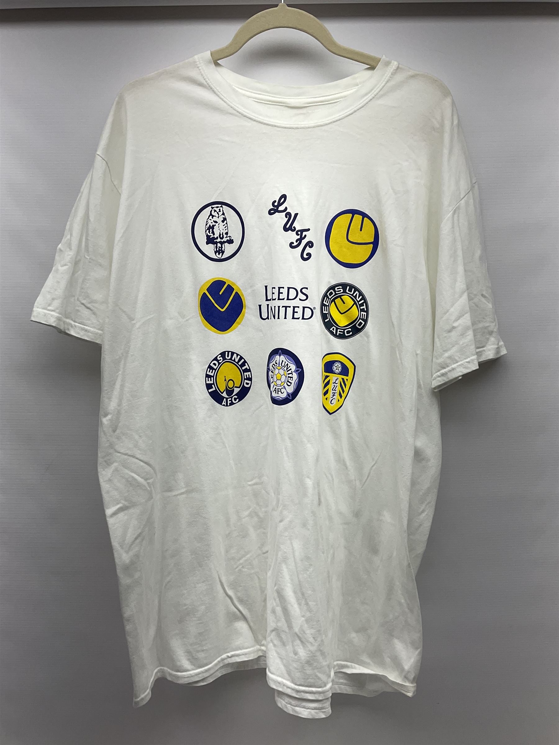 Fourteen items of replica sporting clothing including Leeds United football club shirts, England jerseys etc