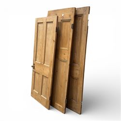 Three reclaimed pine doors with brass handles 