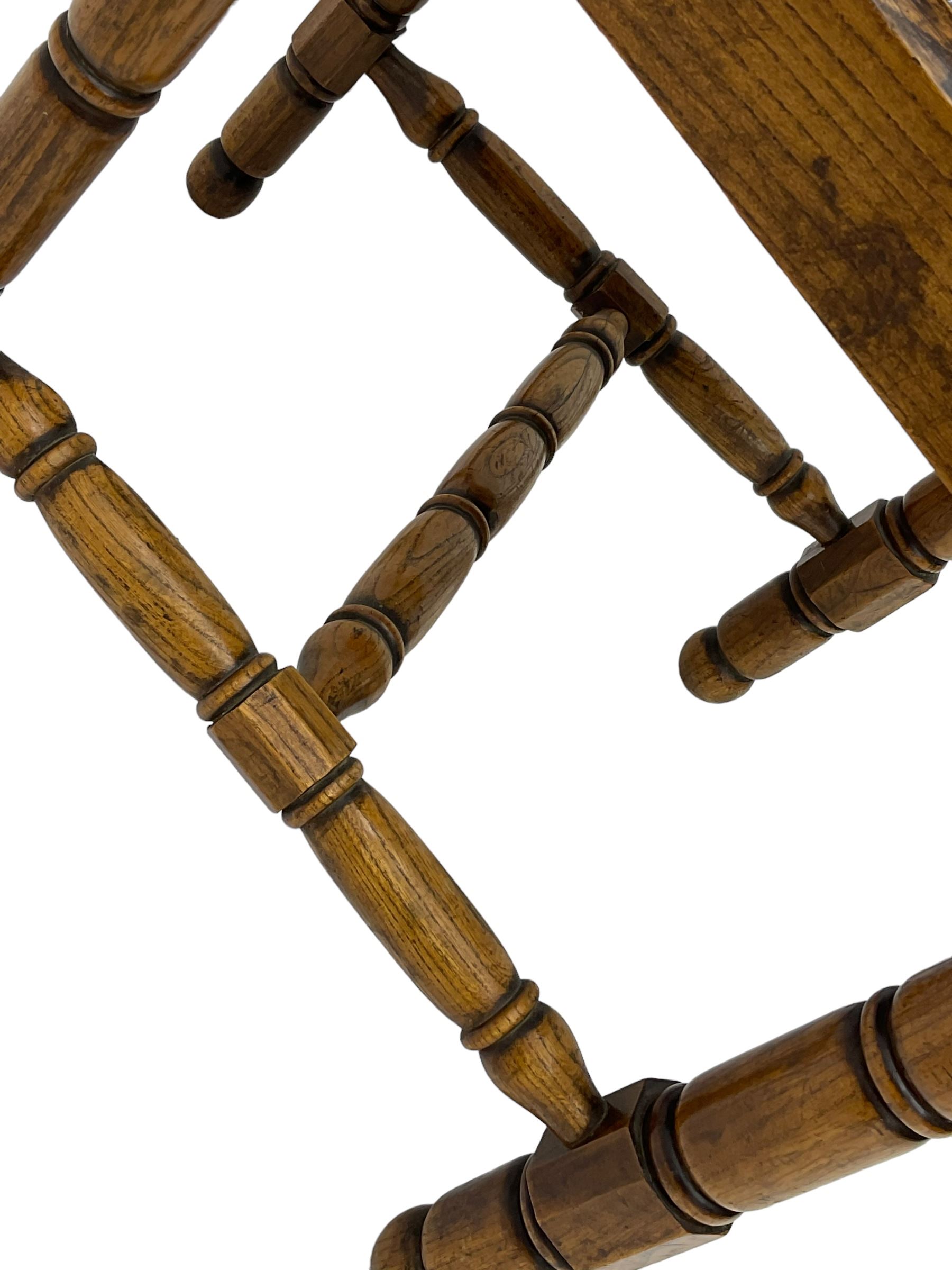 19th century Gothic elm chair, pointed cresting rail over shaped back with central quatrefoil roundel, on turned supports united by turned H-stretchers 