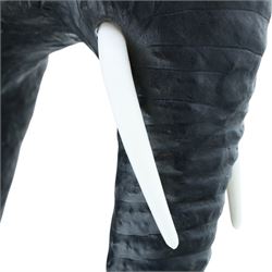 In the style of Liberty & Co - pair of 20th century ebonised leather elephants